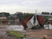 Shipping containers carried away and left in a jumbled pile by floods in Durban, South Africa, Wednesday, April 13, 2022. Flooding in South Africa's Durban area has taken at least 259 lives and is a "catastrophe of enormous proportions," President Cyril Ramaphosa said Wednesday.