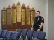 A police officer stands by during a media tour of Congregation Beth Israel in Colleyville, Texas, Thursday, April 7, 2022. Three months after an armed captor took the three men hostage at the synagogue, the house of worship is reopening.