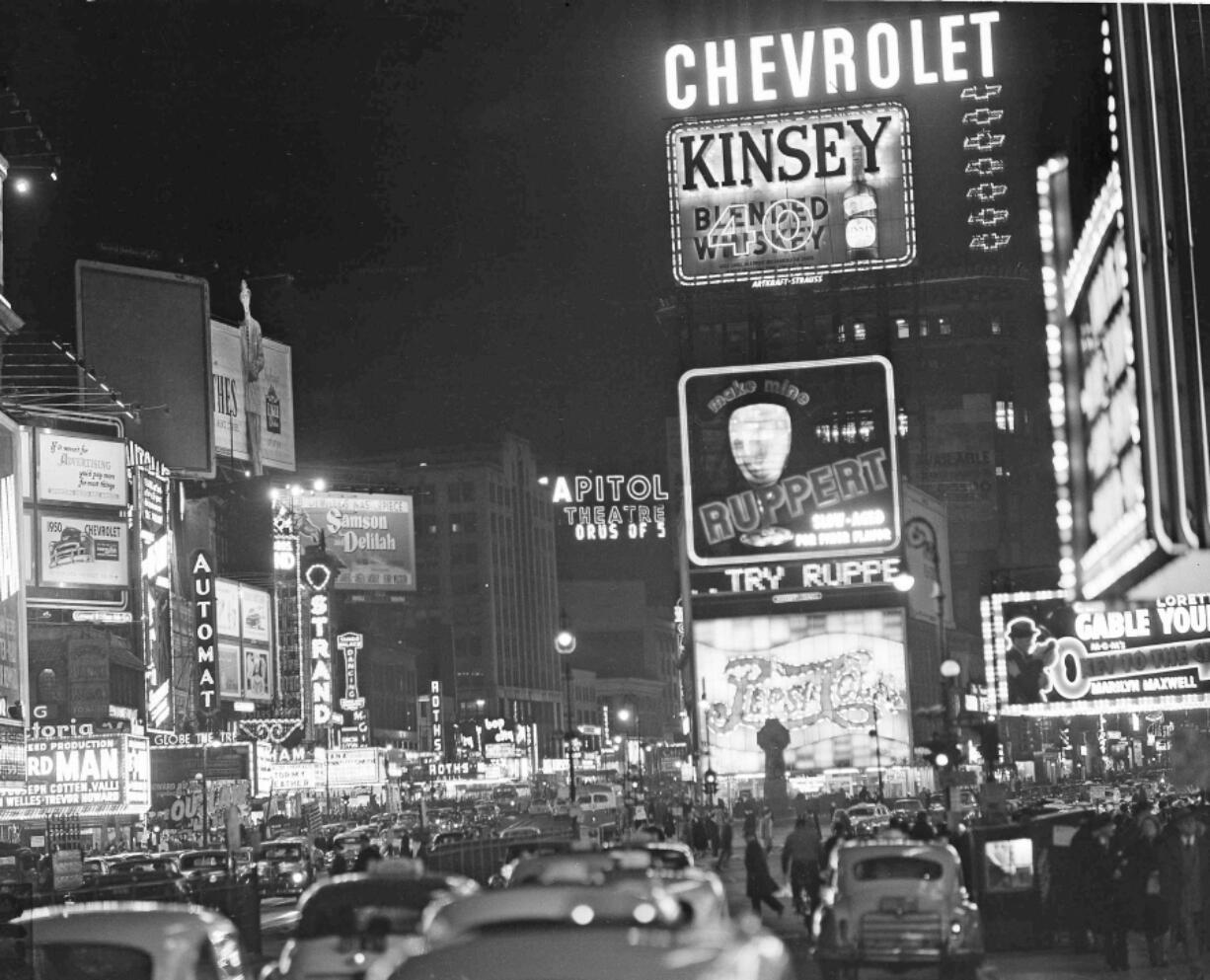 The Times Square section of New York City is pictured with the lights still on before 100 nonstriking maintenance men pulled the switches in a sympathy demonstration in 1950.  Genealogists and historians can get a microscopic look at sweeping historical trends when individual records from the 1950 census are released this week.