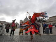 Members of the Assembly of First Nations perform in St. Peter's Square at the Vatican, Thursday, March 31, 2022. Pope Francis has welcomed First Nations delegations to the Vatican. They are seeking an apology for the Catholic Church's role in running Canada's notorious residential schools for Indigenous children.