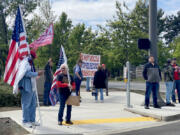 Around a dozen protesters stand outside the Clark County Elections Office on Tuesday afternoon in support of Ed O'Meara. O'Meara was appealing his December ousting as an elections observer.