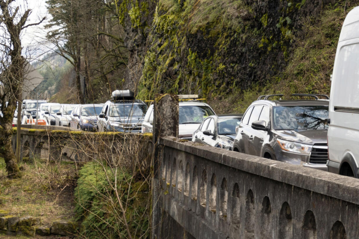 Cars snake along the Historic Columbia River Highway along the waterfall corridor in the Columbia River Gorge. Congestion on busy days has been so bad the traffic impairs the ability of emergency vehicles to respond to accidents.