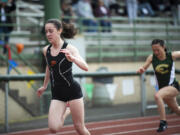 Prairie's Kara Mattson finishes in front of Evergreen's Grace Twiss to win the 3A girls 100-meter hurdles at the 4A and 3A district track and field meet at McKenzie Stadium on Wednesday, May 11, 2022.