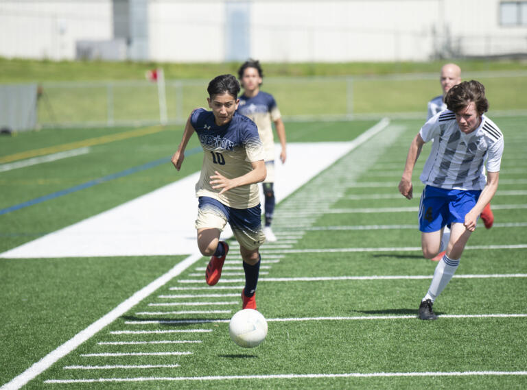 Azriel Salcedo (10) pushes the ball upfield during Seton Catholic's 3-0 win over Elma in the 1A boys soccer district championship game on Saturday, May 14, 2022.