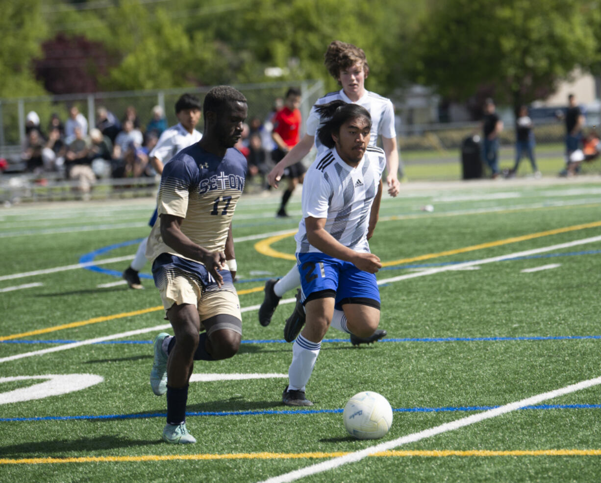 David Moore pushes the ball forward during Seton Catholic's 3-0 win over Elma in the 1A boys soccer district championship game on Saturday in Vancouver.