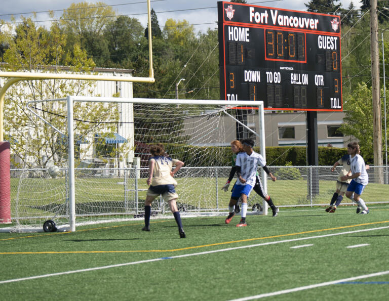 Brady Angelo (14) scores a goal during Seton Catholic's 3-0 win over Elma in the 1A boys soccer district championship game on Saturday, May 14, 2022.