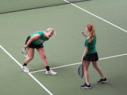 Mountain View's Ari Haygood (left) and Lexi Frost celebrate after winning the girls doubles final at the 3A district tennis tournament at Club Green Meadows on Saturday, May 14, 2022.