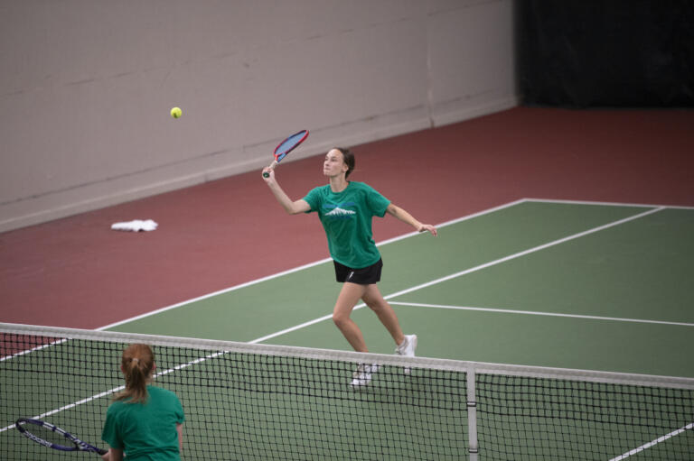 Mountain View's Brynn Desantis returns a shot during the girls doubles final at the 3A district tennis tournament at Club Green Meadows on Saturday, May 14, 2022.