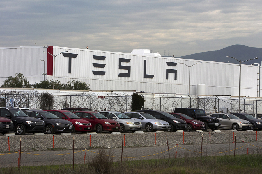 Cars are lined up near the Tesla Motors factory complex in Fremont, Calif., on Thursday, Jan. 28, 2016.