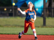 Ridgefield infielder Mallory Vancleave looks to make a throw to first for an out against W.F. West in the 2A District 4 tournament at Recreation Park on May 19, 2020..