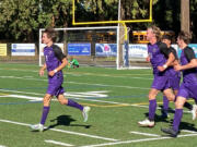 Columbia River?s Alex Harris, left, after scoring his third goal of the match against Othello in the 2A state quarterfinal Saturday, May 22, 2022, at Kiggins Bowl.