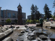 Evan Peek, 8, of Vancouver walks along the water feature in Esther Short Park in May 2019.