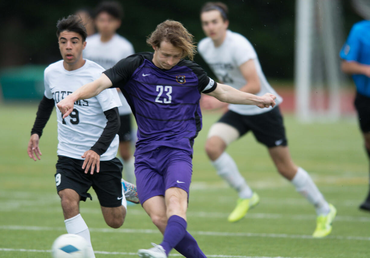 Columbia River's Logan Simmons takes a shot on the run during the first half of the Class 2A state boys soccer third-place game on Saturday, May 28, 2022, in Tumwater.