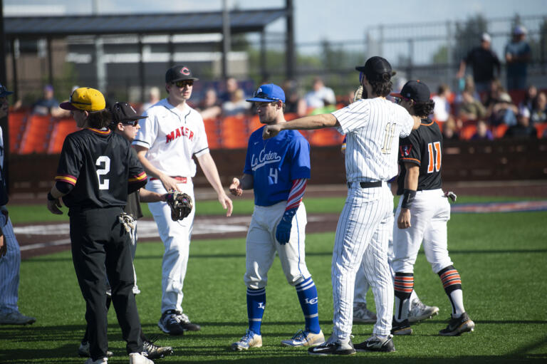 Members of the National League all-stars greet each other after winning Game 1 of the Clark County High School Senior All-Star baseball series at the Ridgefield Outdoor Recreation Center on Tuesday, May 31, 2022.