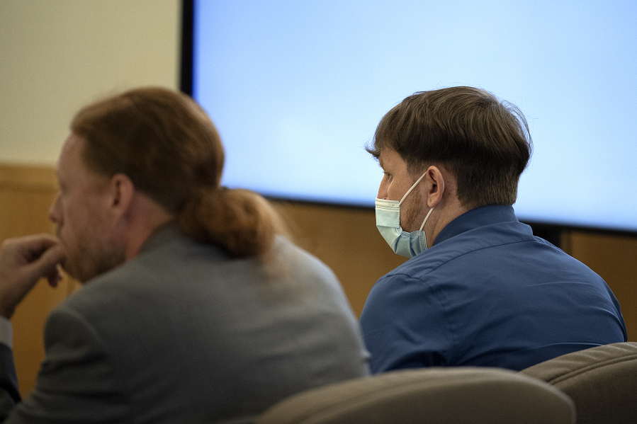 Defense attorney Shon Bogar, left, joins defendant Zachery Hansen during his attempted murder trial at the Clark County Courthouse on Monday morning. Hansen was accused of loosening the lug nuts on his former partner's tires while she had their 4-year-old daughter in the car. On Tuesday, the judge acquitted Hansen of two counts each of second-degree attempted murder and first-degree attempted assault but found him guilty of two counts of second-degree attempted assault.