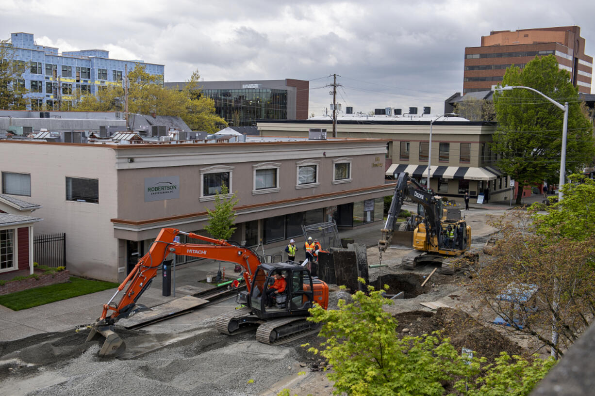 Construction crews work on a sewer and water line project on Broadway in downtown Vancouver on Thursday. Phase 2 of the corridor project, which began in mid-February, is anticipated to be completed in June. The timeline is causing concern among the shops in the area, as they have faced significant drops in business since it began. Phase 1 was completed in 2021.