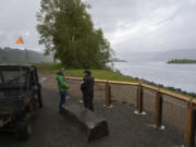 Jasmine Zimmer-Stucky of the Lower Columbia Estuary Partnership, left, chats with Juliette Fernandez of the U.S. Fish and Wildlife Service as they check out a view of the Columbia River from a new viewpoint at Steigerwald Lake National Wildlife Refuge on Monday afternoon. The refuge reopened to the public on May 1.