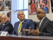 Vancouver police chief candidate and current Vancouver Assistant Police Chief Troy Price, right, introduces himself Tuesday during a community Q&A session. The chosen candidate will replace current police Chief James McElvain, who is slated to retire June 30.