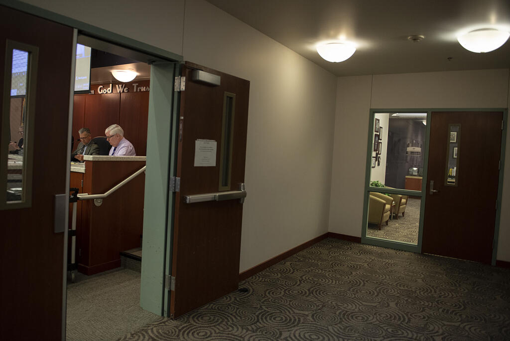 Clark County Councilors Gary Medvigy, left, and Richard Rylander work during a meeting at the Clark County Public Service Center on May 3.