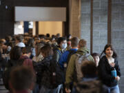 A crowd of students walk through the school's cafeteria to head toward their first class at View Ridge Middle School on May 4. The proposed levy wouldn't fund construction projects, rather it would provide funding for critical health services and student extracurricular programs.