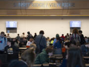 Students gather in the cafeteria at View Ridge Middle School before school on May 4, 2022.
