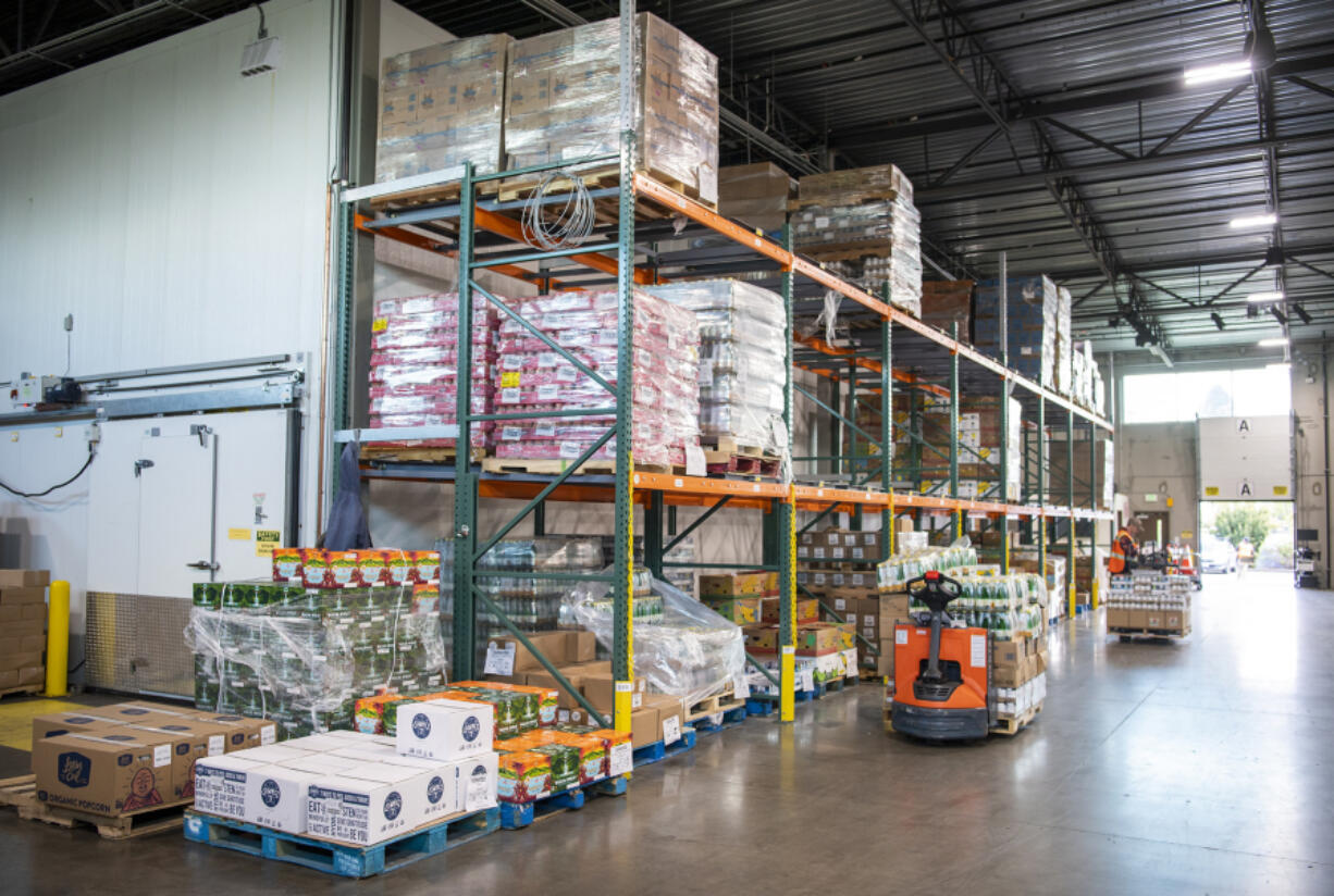 Pallets of food sit inside the Clark County Food Bank. "The food from Walk and Knock ran out around early April, so the Stamp Out Hunger food drive is coming at a really great time, especially because spring and summer are historically not a time that people donate a lot of food," said Clark County Food Bank warehouse manager Brent Derocher.