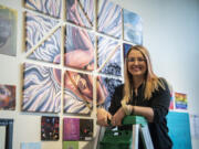 Vancouver-based artist Sarah Lynne Hunter stands beneath her community art exhibit "Isolation/Together" at Dandelion Teahouse and Apothecary. Anyone is invited to create their own art pieces at a Community Art Party, 4-8 p.m. Friday.