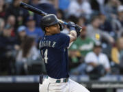 Seattle Mariners' Julio Rodriguez hits a single off Oakland Athletics starting pitcher Zach Logue during the fifth inning of a baseball game, Monday, May 23, 2022, in Seattle.