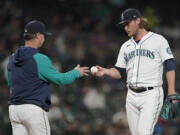 Seattle Mariners pitcher Drew Steckenrider is pulled by manager Scott Servais, left, during the sixth inning of the team's baseball game against the Oakland Athletics, Tuesday, May 24, 2022, in Seattle. (AP Photo/Ted S.