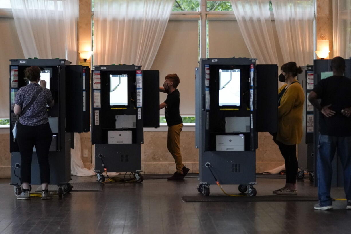 People vote in the Georgia's primary election on Tuesday, May 24, 2022, in Atlanta.