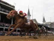 Rich Strike (21), with Sonny Leon aboard, wins the 148th running of the Kentucky Derby horse race at Churchill Downs Saturday, May 7, 2022, in Louisville, Ky.