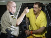 Escaped inmate Casey White, right, arrives at the Lauderdale County Courthouse in Florence, Ala., after waiving extradition in Indiana Tuesday, May 10, 2022.