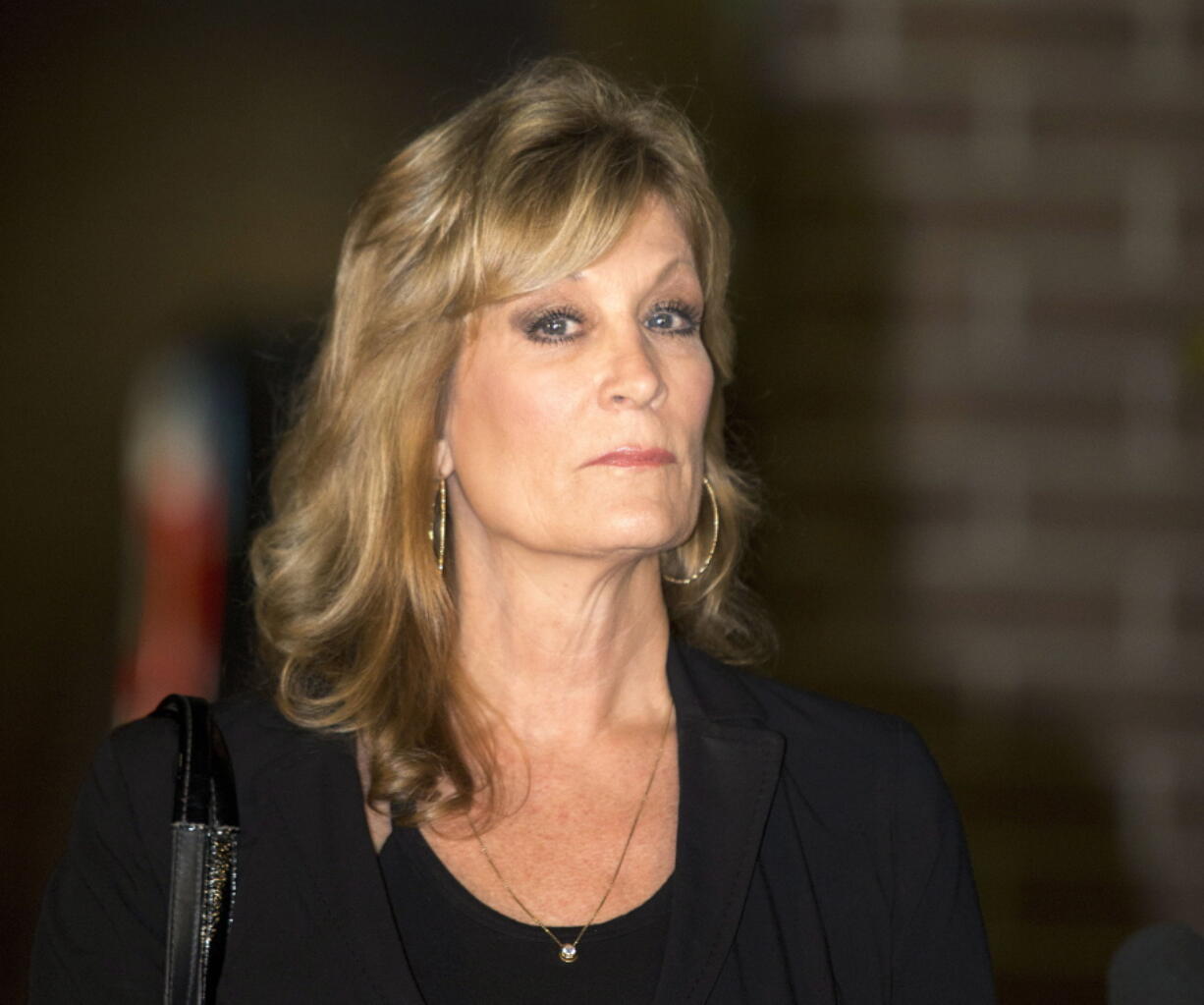 FILE - Judy Huth appears at a news conference outside the Los Angeles Police Department's Wilshire Division station in Los Angeles on Dec. 5, 2014. Eleven months after he was freed from prison, 85-year-old Bill Cosby will again be the defendant in a sexual assault proceeding, this time a civil case in California. Judy Huth, who is now 64, alleges that in 1975 when she was 16, Cosby sexually assaulted her at the Playboy Mansion.