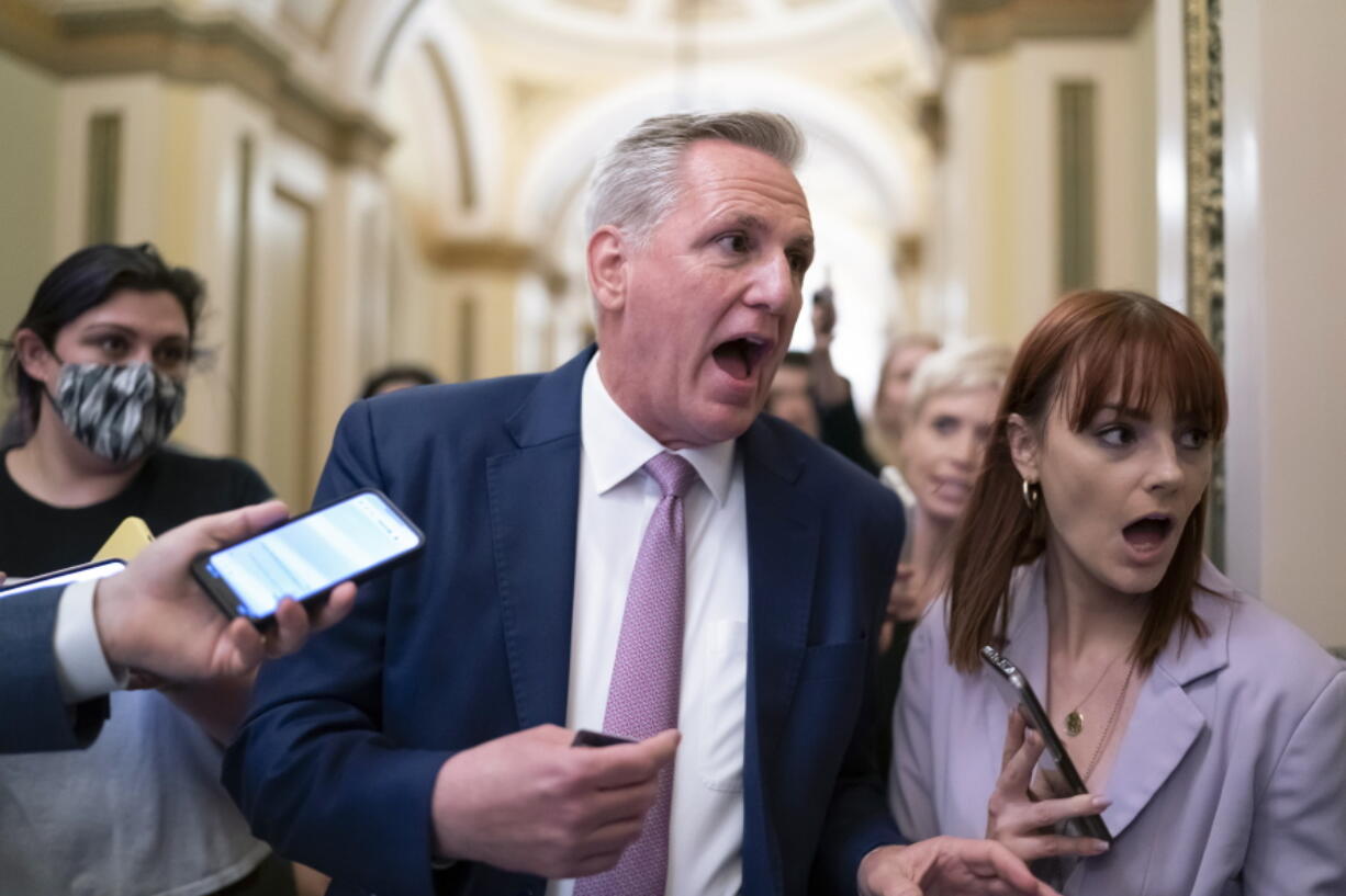 House Minority Leader Kevin McCarthy, R-Calif., heads to his office surrounded by reporters after House investigators issued a subpoena to McCarthy and four other GOP lawmakers as part of their probe into the violent Jan. 6 insurrection, at the Capitol in Washington, Thursday, May 12, 2022. The House Select Committee on the January 6 Attack has been investigating McCarthy's conversations with then-President Donald Trump the day of the attack and meetings that the four other lawmakers had with the White House as Trump and his aides conspired how to overturn his defeat. (AP Photo/J.