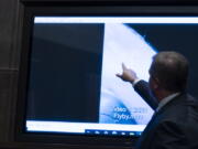 Deputy Director of Naval Intelligence Scott Bray points to a video display of a UAP during a hearing of the House Intelligence, Counterterrorism, Counterintelligence, and Counterproliferation Subcommittee hearing on "Unidentified Aerial Phenomena," on Capitol Hill, Tuesday, May 17, 2022, in Washington.