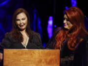 Ashley Judd, left, cries as she speaks while sister Wynonna Judd listens during the Country Music Hall of Fame Medallion Ceremony Sunday, May 1, 2022, in Nashville, Tenn.