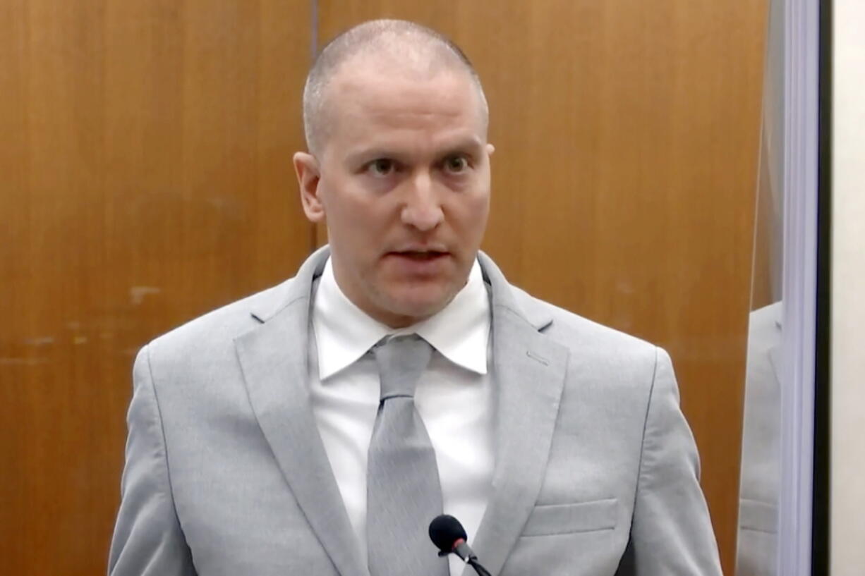 FILE - Former Minneapolis police Officer Derek Chauvin addresses the court as Hennepin County Judge Peter Cahill presides over Chauvin's sentencing at the Hennepin County Courthouse in Minneapolis, on June 25, 2021. Two Minnesotans filed federal civil rights lawsuits on Tuesday, May 31, 2022, against the city of Minneapolis and former Officer Derek Chauvin, alleging they were traumatized when he used his "signature move" on them of kneeling on a subject's neck -- the same way that he killed George Floyd.