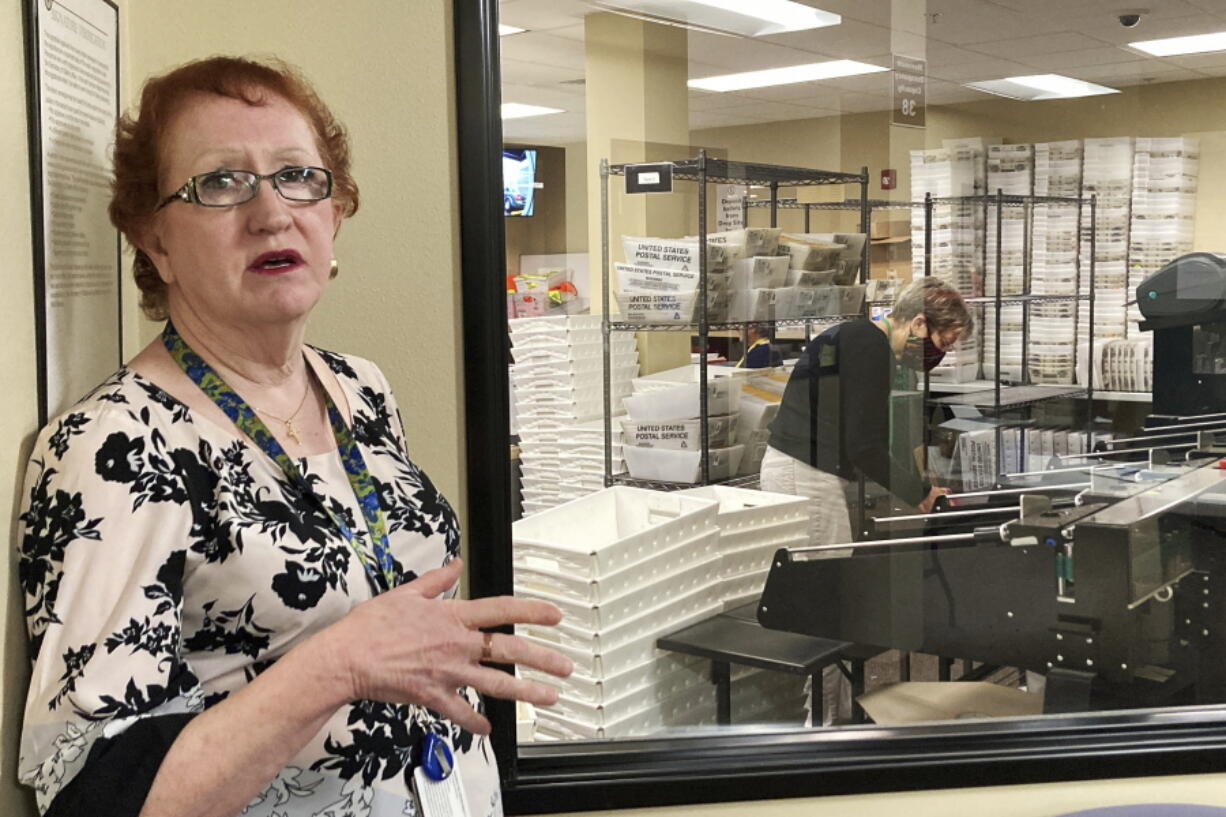 FILE-- Clackamas County Elections Clerk Sherry Hall speaks at the office on Thursday, May 19, 2022, Oregon City, Ore. Ballots with blurry barcodes that can't be read by vote-counting machines are delaying election results by weeks in a key U.S. House race in Oregon's primary. Hall said the problem first came to light May 3, when elections workers put the first ballots returned in the vote-by-mail state through the vote-counting machine.