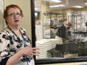 FILE-- Clackamas County Elections Clerk Sherry Hall speaks at the office on Thursday, May 19, 2022, Oregon City, Ore. Ballots with blurry barcodes that can't be read by vote-counting machines are delaying election results by weeks in a key U.S. House race in Oregon's primary. Hall said the problem first came to light May 3, when elections workers put the first ballots returned in the vote-by-mail state through the vote-counting machine.