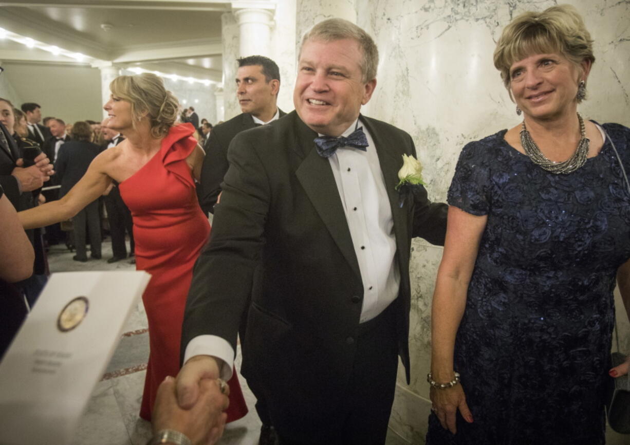 FILE - Idaho Attorney General Lawrence Wasden and his wife, Tracey Wasden, attend the Inaugural Procession and Ball on Jan. 5, 2019, in Boise, Idaho. Wasden is seeking a sixth term as state attorney general. Idaho's primary elections are Tuesday, May 17, 2022.