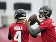 Atlanta Falcons quarterback Marcus Mariota throws a pass during NFL football practice Thursday, May 26, 2022, in Flowery Branch, Ga.