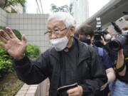 Catholic Cardinal Joseph Zen leaves after an appearance at a court in Hong Kong as he was charged in relation to their past fundraising for activists, Tuesday, May 24, 2022.