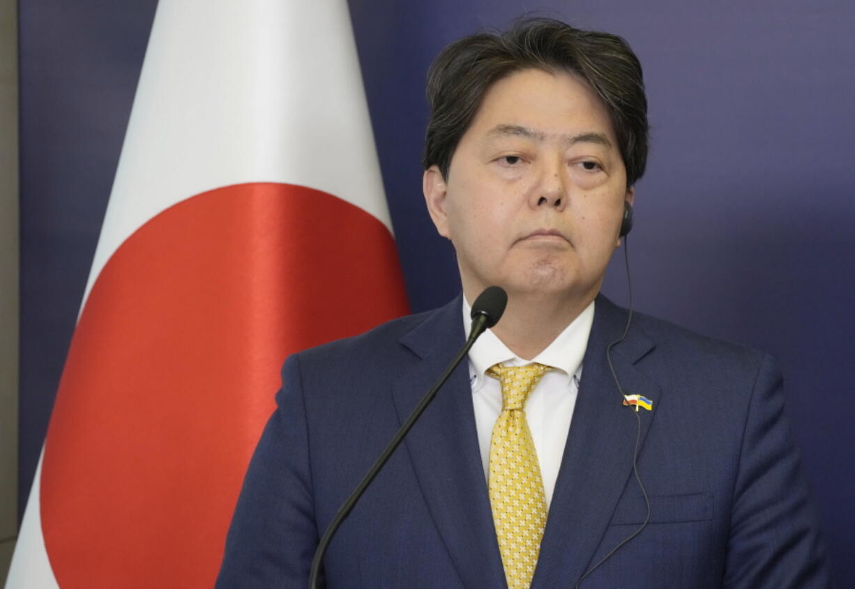 Japan's Foreign Minister Yoshimasa Hayashi attends a news conference with his Polish counterpart Zbigniew Rau in Warsaw, Poland, Monday, April 4, 2022. Japan announced Friday, May 6, 2022, that Hayashi will attend new South Korean President Yoon Suk Yeol's inauguration ceremony next week as part of an effort to bring the countries' damaged relations back to normal.