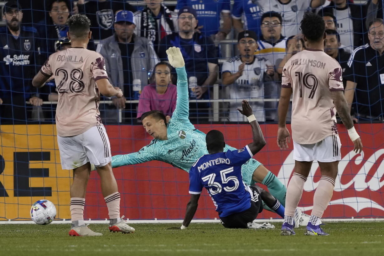 San Jose Earthquakes midfielder Jamiro Monteiro (35) scores a goal past Portland Timbers goalkeeper Alja? Iva?i? (31) during the second half of an MLS soccer match in San Jose, Calif., Wednesday, May 18, 2022. San Jose won 3-2.