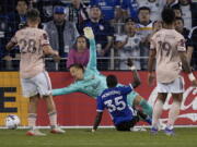 San Jose Earthquakes midfielder Jamiro Monteiro (35) scores a goal past Portland Timbers goalkeeper Alja? Iva?i? (31) during the second half of an MLS soccer match in San Jose, Calif., Wednesday, May 18, 2022. San Jose won 3-2.