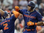 Houston Astros' Jeremy Pena (3) celebrates with Alex Bregman (2) after hitting a two-run home run against the Seattle Mariners during the sixth inning of a baseball game Monday, May 2, 2022, in Houston. (AP Photo/David J.