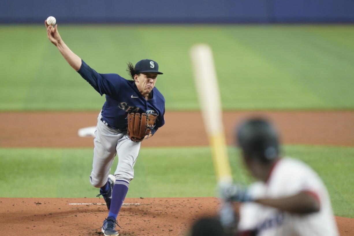 Seattle Mariners' Logan Gilbert pitches to Miami Marlins' Jesus Sanchez during the first inning of a baseball game, Sunday, May 1, 2022, in Miami.