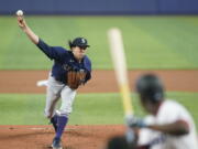 Seattle Mariners' Logan Gilbert pitches to Miami Marlins' Jesus Sanchez during the first inning of a baseball game, Sunday, May 1, 2022, in Miami.