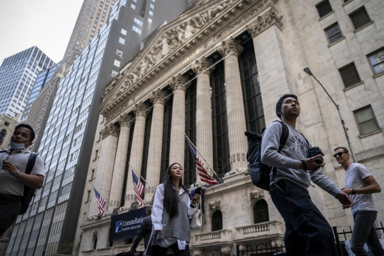 FILE - Pedestrians pass the New York Stock Exchange, May 5, 2022, in the Manhattan borough of New York. Stocks are opening modestly lower on Wall Street Monday, May 16, 2022 continuing a losing streak that has brought the market down for six weeks in a row. The S&P 500 was down 0.6% in the early going, while more declines in technology companies pulled the Nasdaq down 1.1%. The Dow Jones Industrial Average fell 0.3%. Spirit Airlines rose 7% after JetBlue said it would make a hostile offer for the budget carrier after Spirit rebuffed its earlier bid.