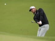 Mito Pereira, of Chile, chips to the green on the fourth hole during the third round of the PGA Championship golf tournament at Southern Hills Country Club, Saturday, May 21, 2022, in Tulsa, Okla.